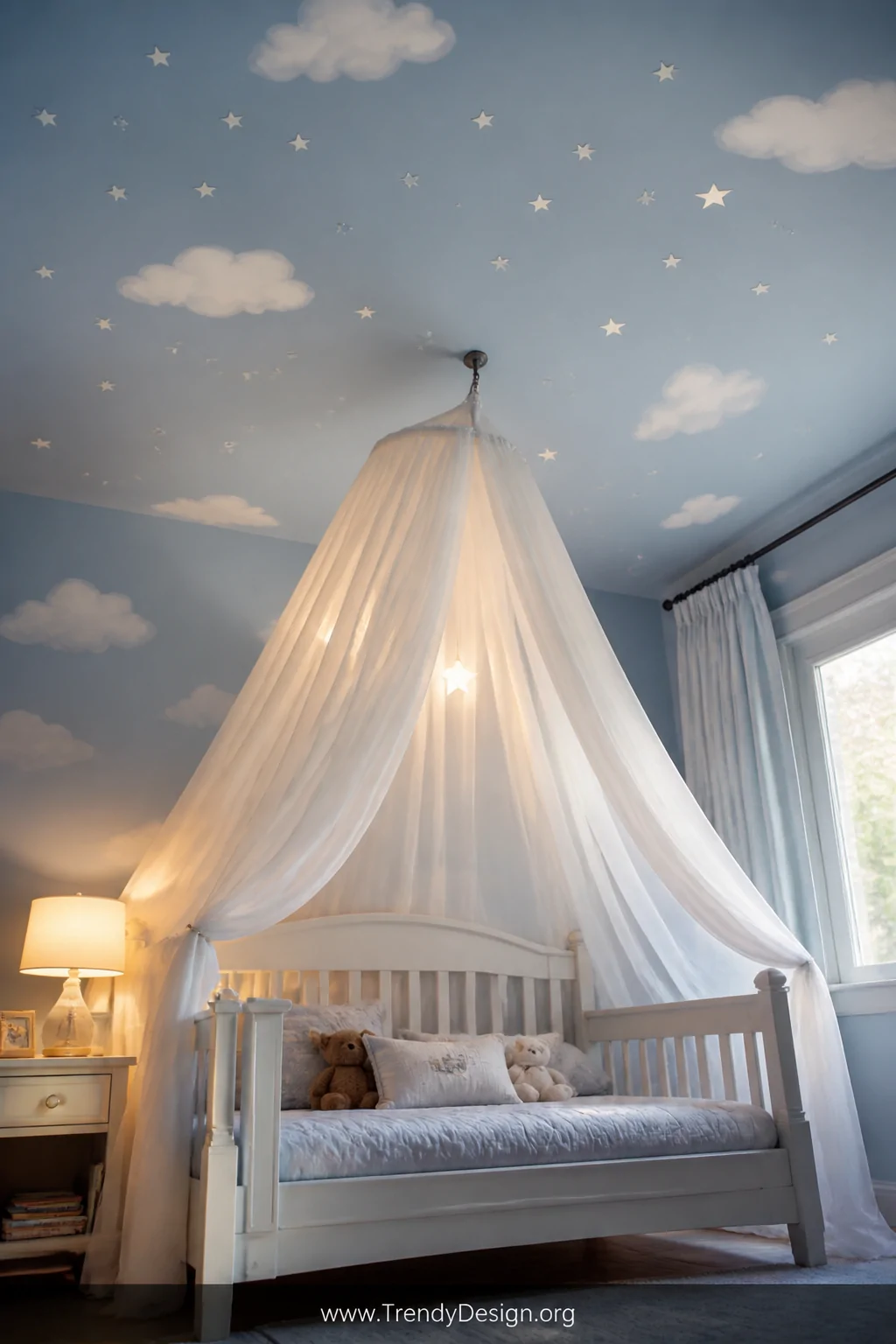 Medium upward-angled shot of a toddler boy bedroom ceiling painted soft sky blue adorned with fluffy white cloud decals and s