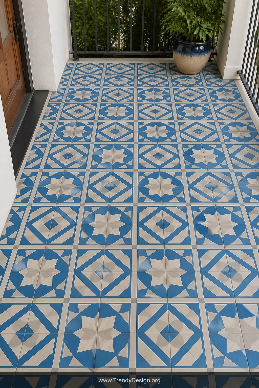 Medium shot looking down at a concrete porch floor painted in a crisp faux tile pattern using painter's tape technique, featu