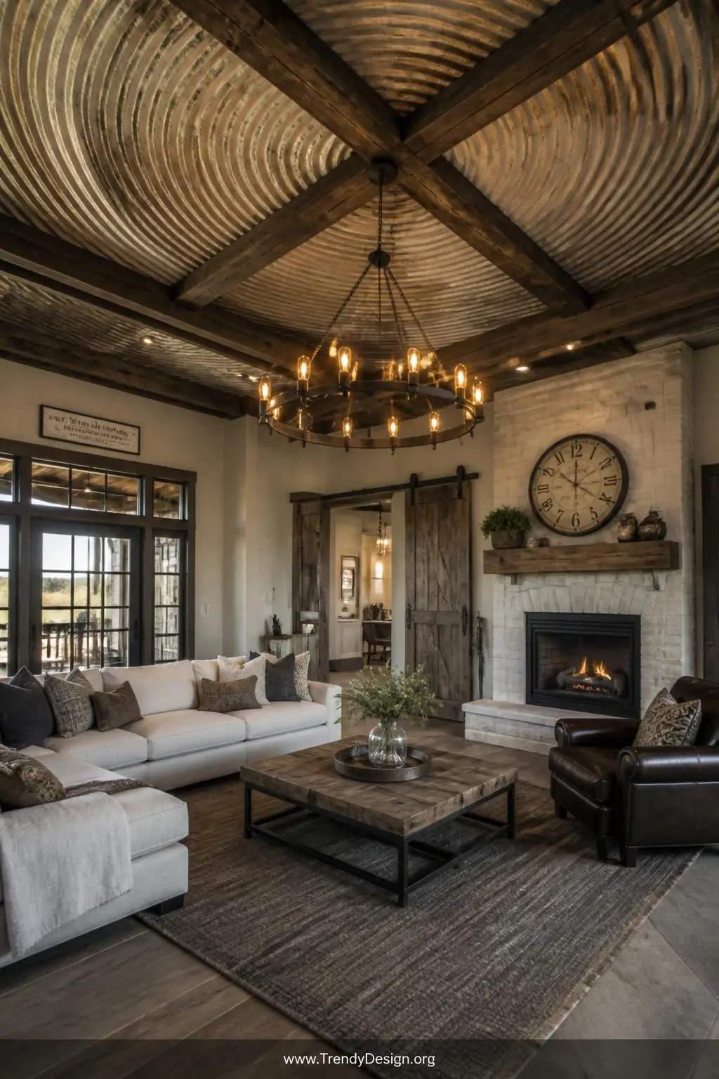 Corrugated grain bin ceiling panels installed overhead in a rustic living room, wide shot, warm Edison bulb glow illuminating the circular ribbed metal pattern between dark exposed wooden beams, natural aged patina finish with cream-painted sections, industrial farmhouse style, photorealistic interior design.