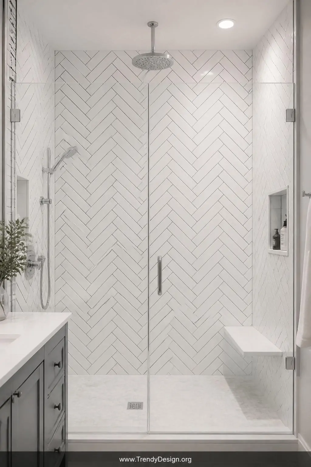 Floor-to-ceiling white subway tiles in a herringbone pattern with bold dark charcoal grout behind a crystal-clear frameless glass shower door in a modern bathroom, glossy tile surfaces reflecting soft overhead light creating an illusion of endless height, medium shot, photorealistic interior design.