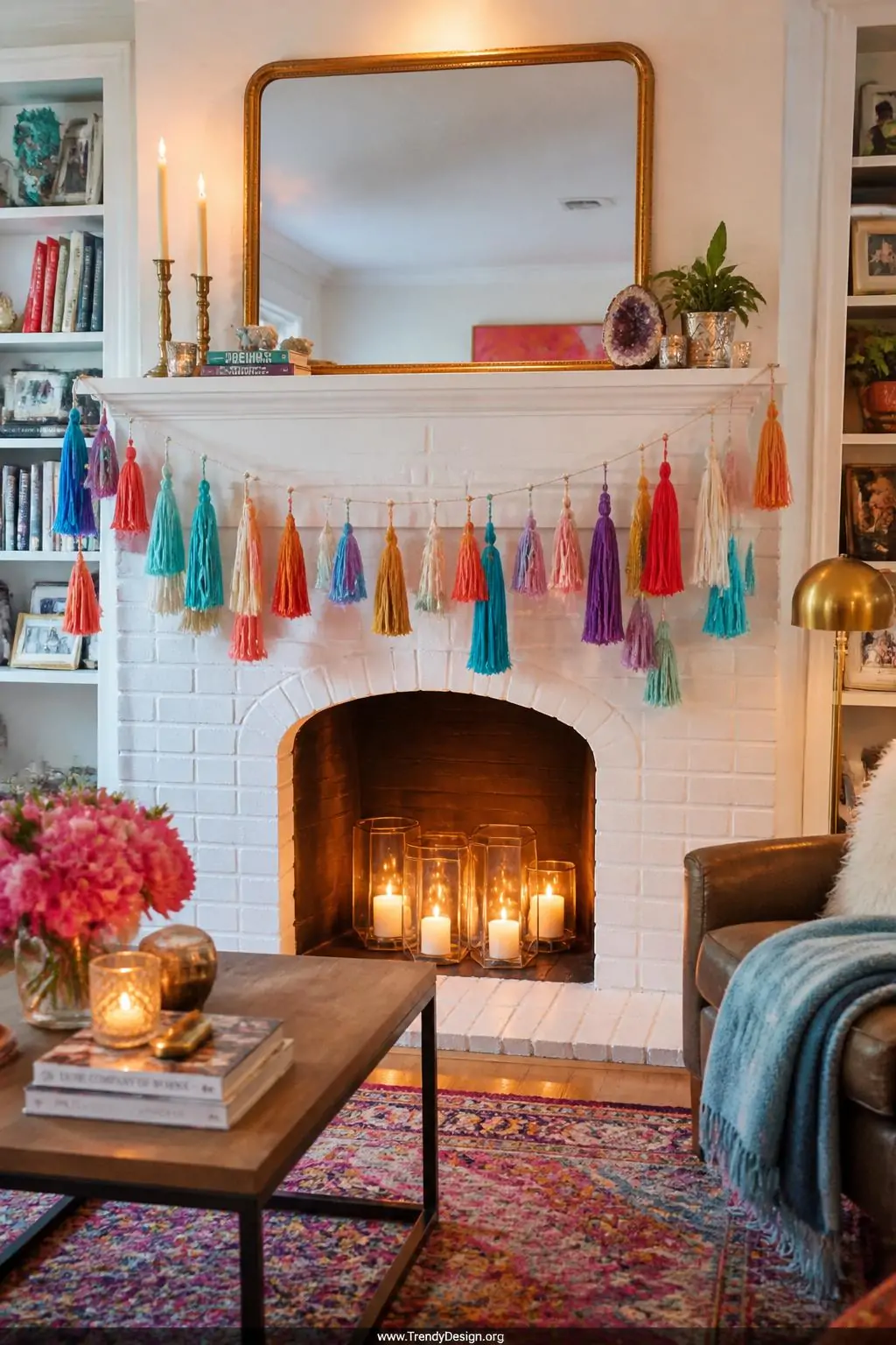 Colorful embroidery floss tassel garland draped across a white painted brick fireplace mantel, eclectic living room, fluffy multicolored tassels in coral, turquoise, violet, and gold strung on natural twine at varied lengths, warm ambient candlelight, wide shot.