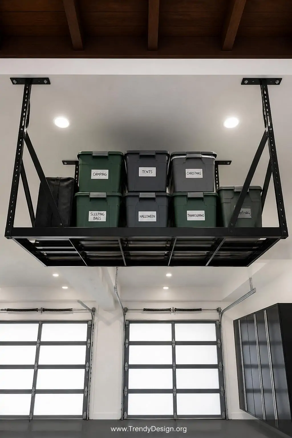 Medium photorealistic interior design shot looking upward at a ceiling-mounted overhead storage platform in matte black steel