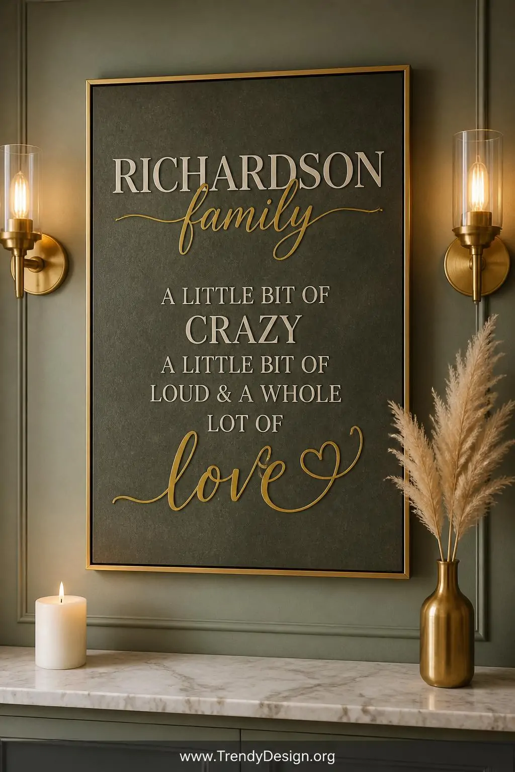 A medium closeup of a framed typographic canvas hanging on a dusty sage green painted wall, elegant serif and script fonts la