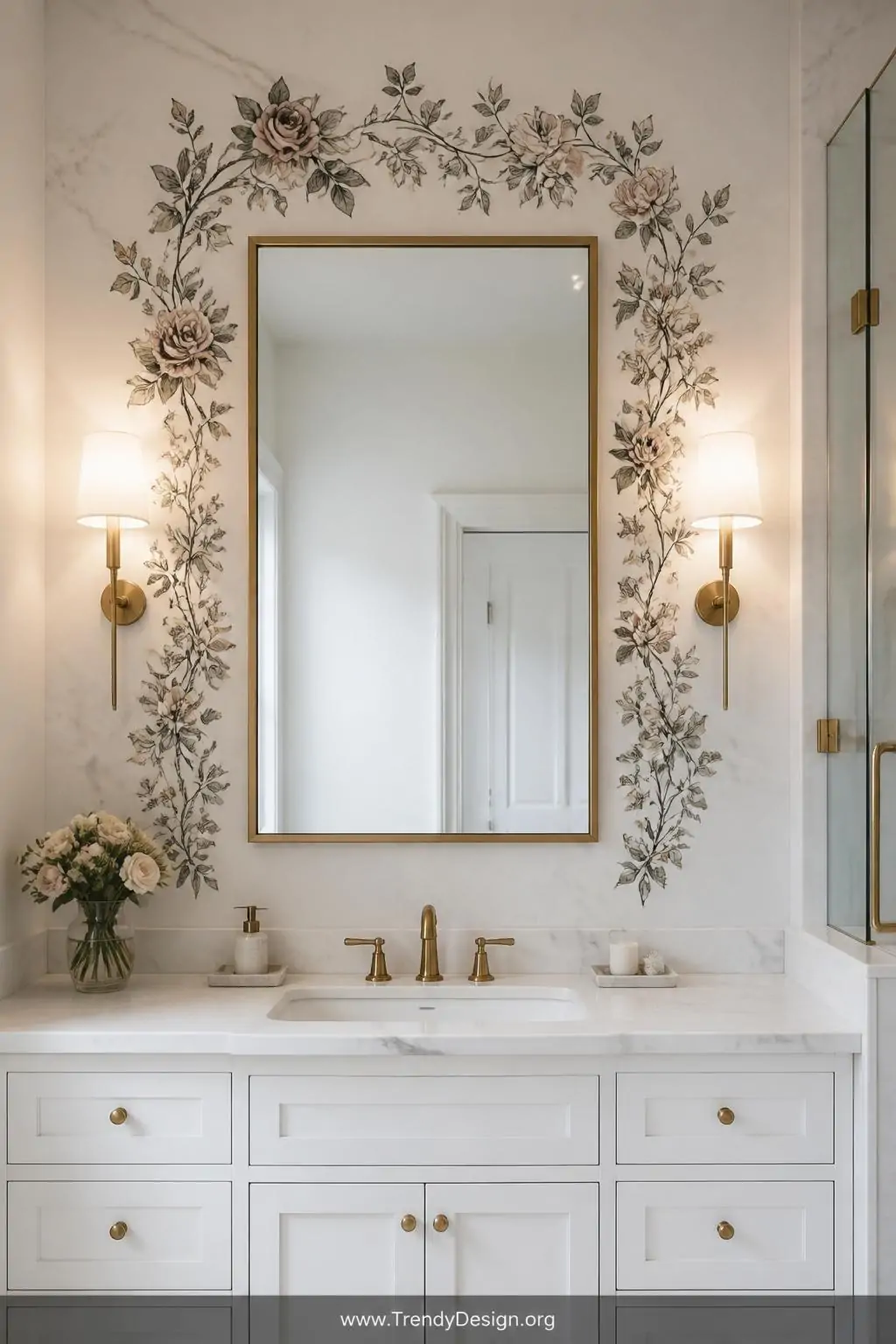 Hand-drawn rose and trailing vine floral wreath stickers arranged as a dramatic border around a plain rectangular bathroom mirror, soft diffused vanity lighting, medium shot of a white marble bathroom with brushed brass fixtures.
