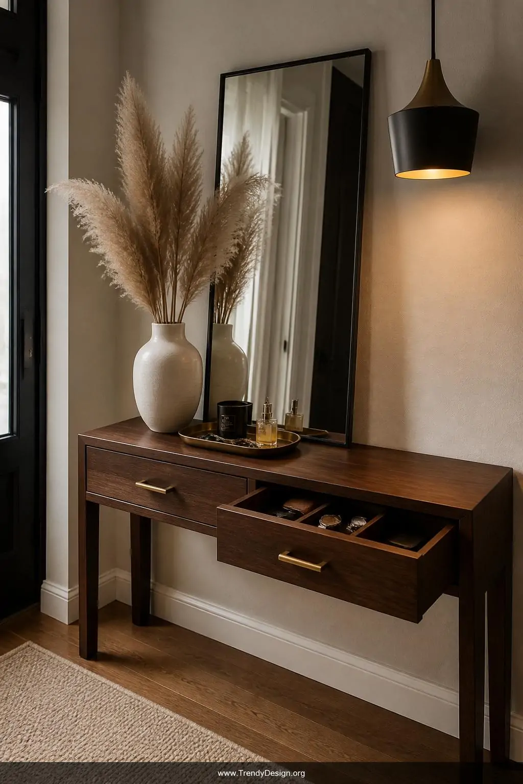 A medium photorealistic interior design shot of a rich dark walnut console table with two deep brass-hardware drawers positio