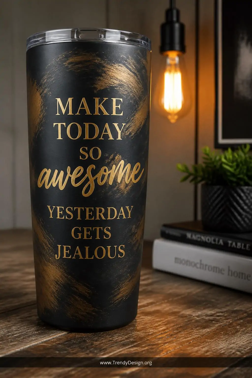 A closeup shot of a matte black sublimation tumbler sitting on a rustic reclaimed wood desk surface, displaying bold elegant 