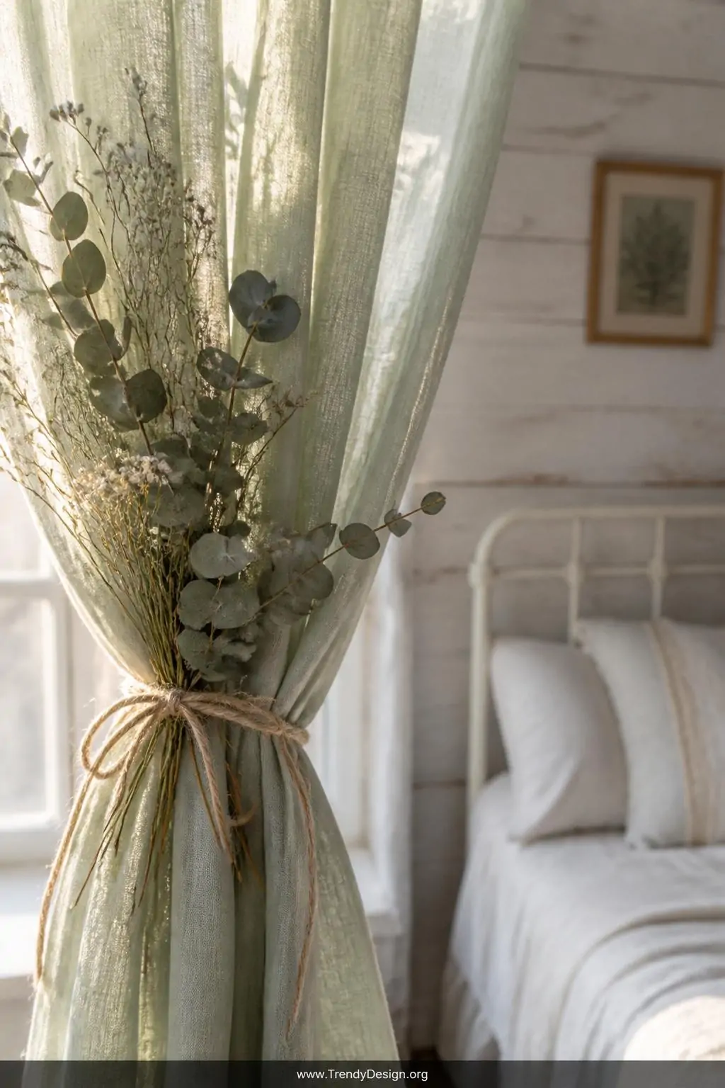Close-up photorealistic shot of a dried eucalyptus and baby's breath bundle tieback tied with natural twine gathering soft sa