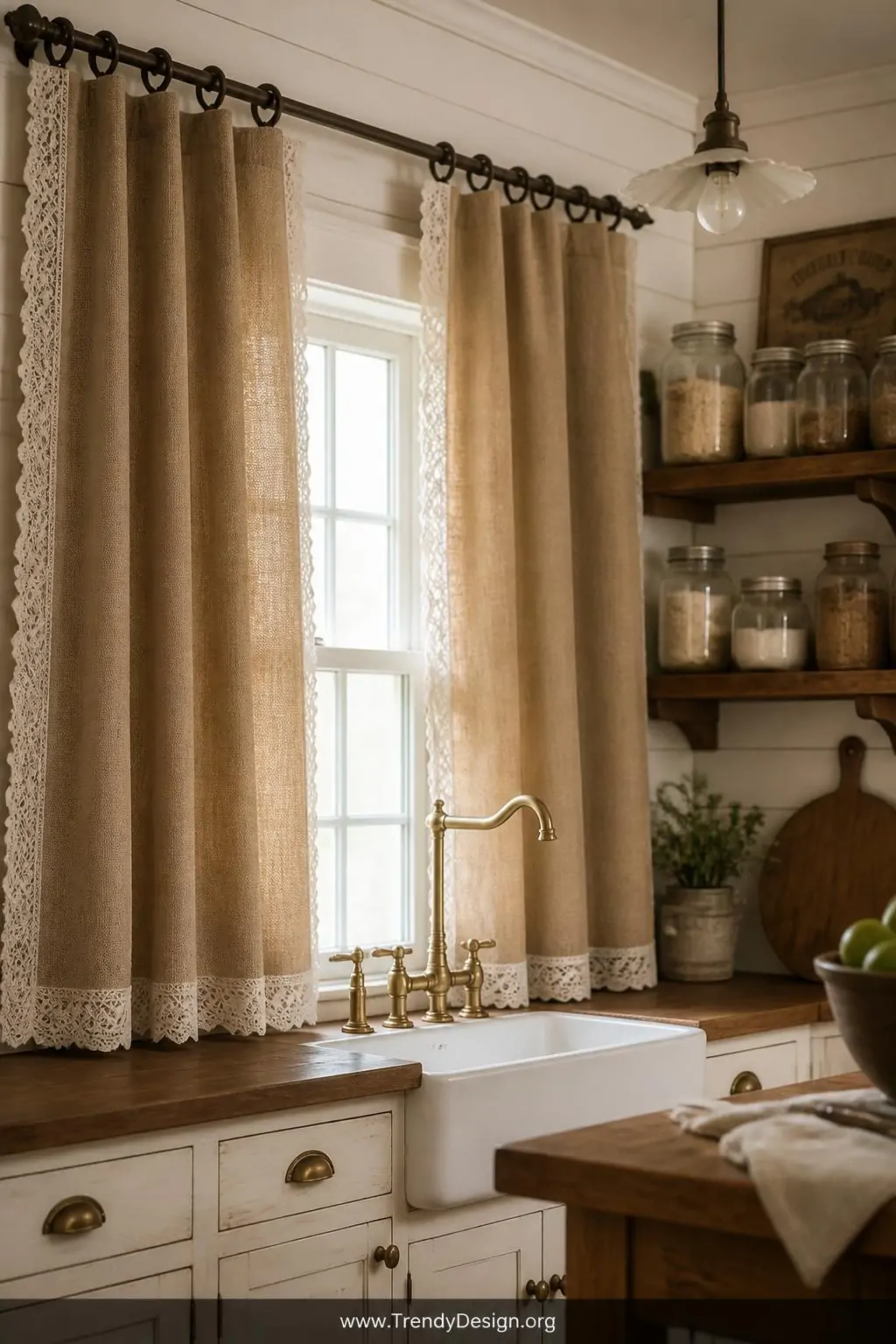 Heavyweight burlap and cotton blend curtains with delicate white lace trim hanging from wrought iron rods in a rustic farmhouse kitchen with shiplap walls, mason jar accessories on open shelving, and vintage brass hardware, medium shot, warm ambient light, photorealistic interior design.