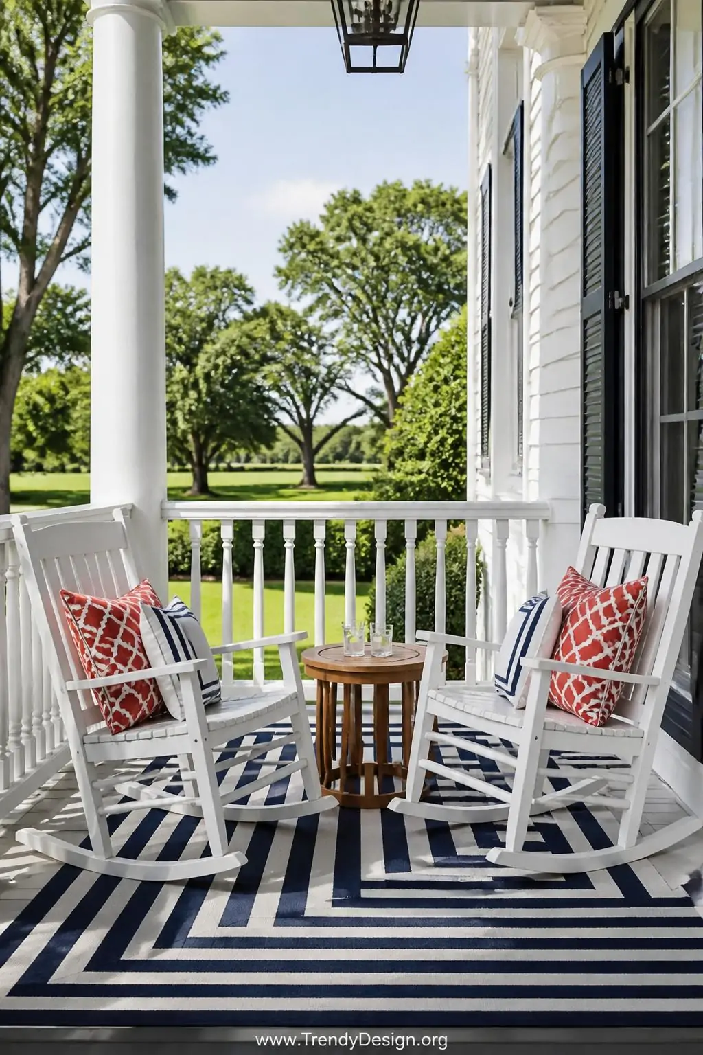 Wide photorealistic shot of a colonial front porch seating vignette featuring two glossy white wooden rocking chairs angled c