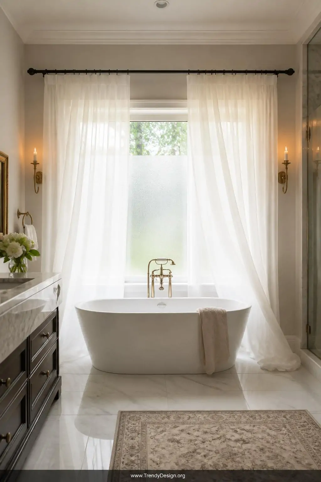 Wide shot of a luminous romantic bathroom with floor-length ivory voile privacy sheer curtains hung on a rust-proof matte bla