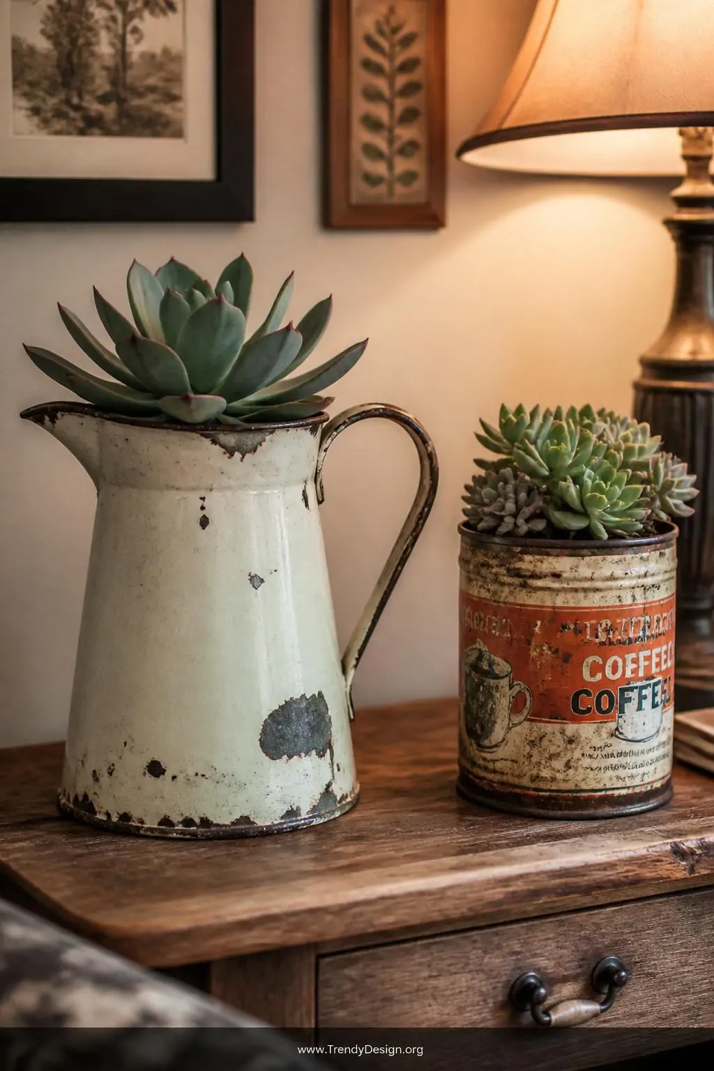 A worn enamel pitcher and a vintage tin can repurposed as charming succulent homes sitting atop a rustic wooden side table, soft warm lamplight illuminating their chipped patina and storytelling texture against a cozy, eclectic room backdrop, closeup shot, photorealistic interior design.