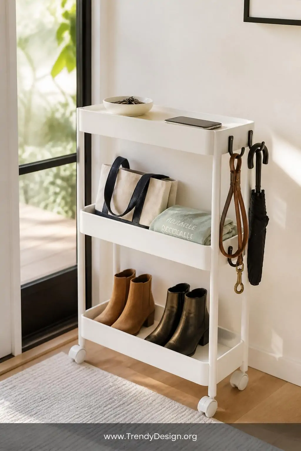 A close-up photorealistic interior design image of a slim white powder-coated three-tier rolling storage cart positioned besi
