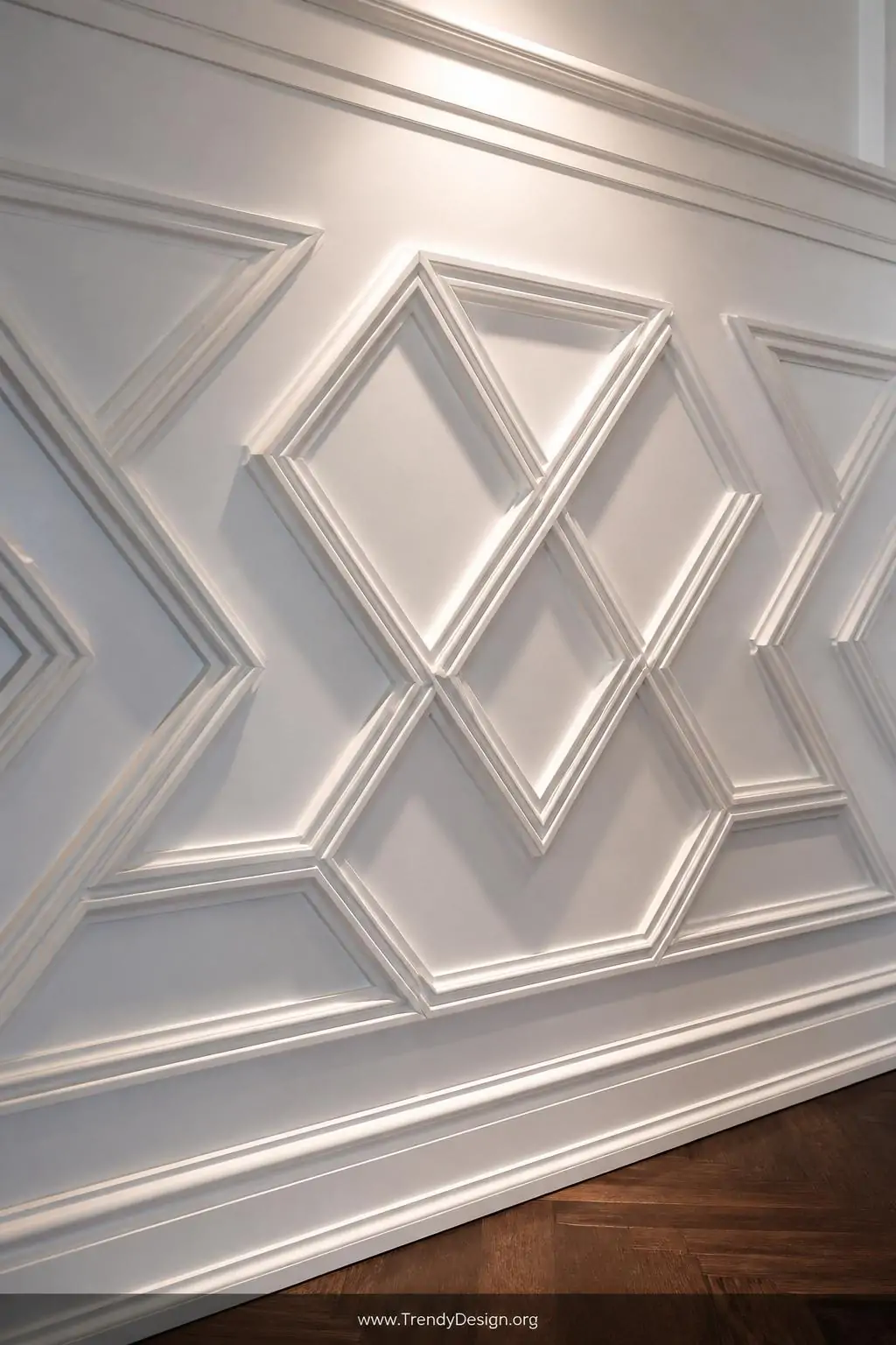 Closeup shot of an intricate Venetian-inspired diamond-pattern geometric molding wainscoting painted all-white on a white wal